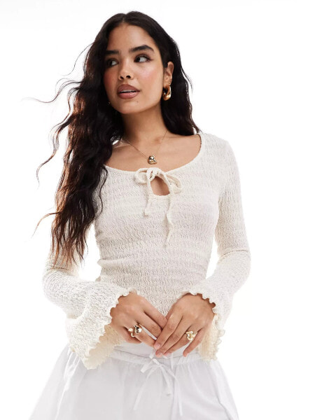 ASOS DESIGN textured asymmetric angel sleeve top in ivory