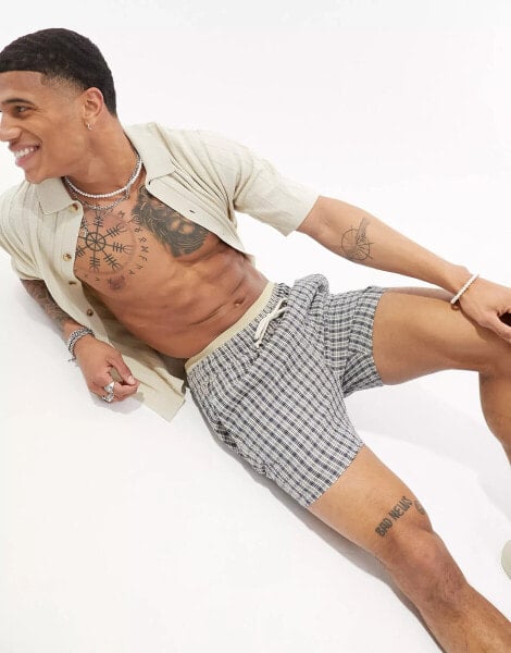 ASOS DESIGN slim textured shorts in shorter length in check