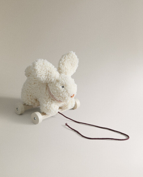 Children's soft toy rabbit with wheels