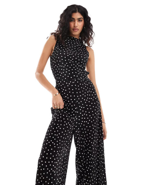 ASOS DESIGN plisse sleeveless high neck wide leg jumpsuit in mono polka dot