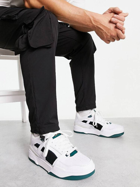 Puma slipstream trainers in white with black and green suede detail