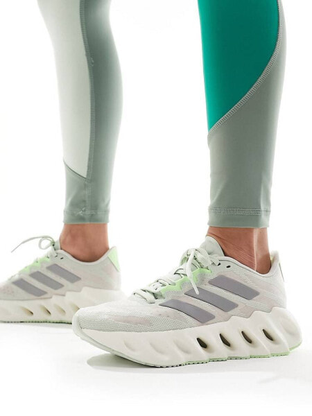 adidas Running Switch FWD trainers in soft green and silver