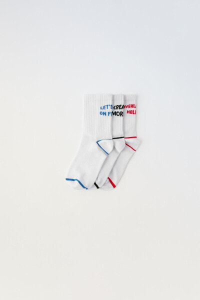 Pack of three pairs of sports socks with slogan