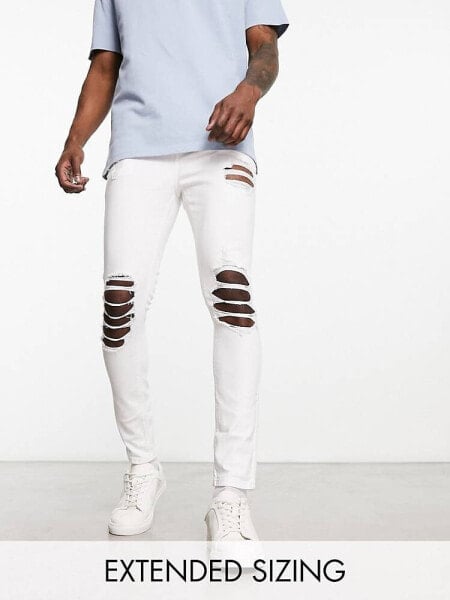 ASOS DESIGN spray on jeans with power stretch with heavy rips in white