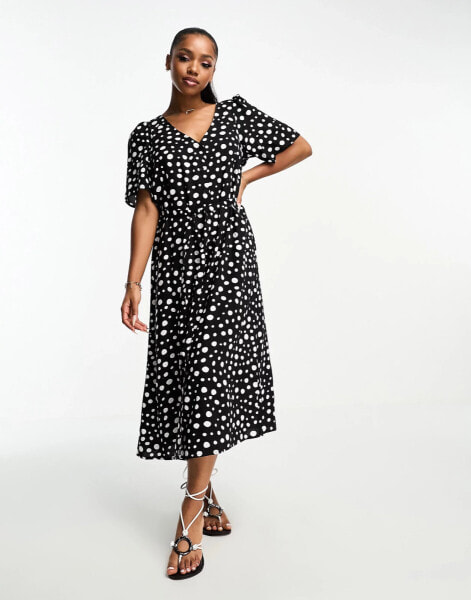 Monki wrap midi dress in black and white spots