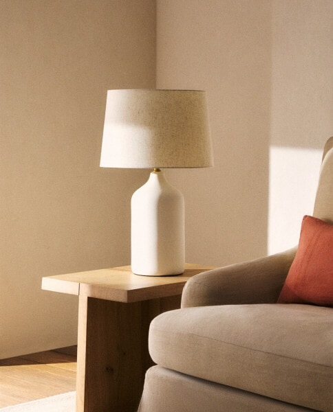 Table lamp with white ceramic base