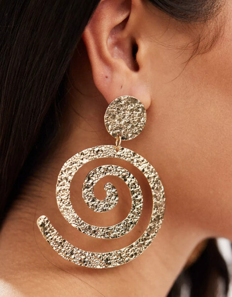 ASOS DESIGN drop earrings with hammered swirl design in gold tone