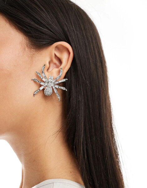 ASOS DESIGN Halloween stud earrings with crystal spider design in gunmetal