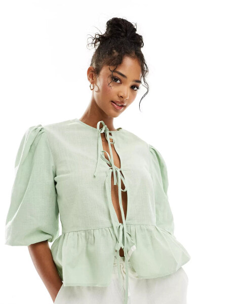 ASOS DESIGN linen blend tie front peplum tie front blouse in green