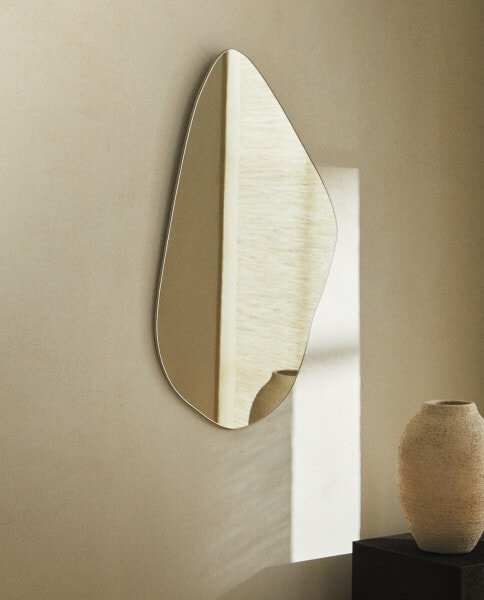 Asymmetric wall mirror