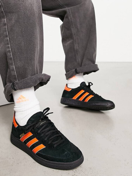 adidas Originals Handball Spezial gum sole trainers in black and orange - BLACK
