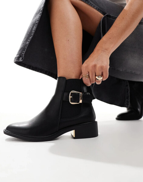 SEQWL ankle boots with buckle details in black