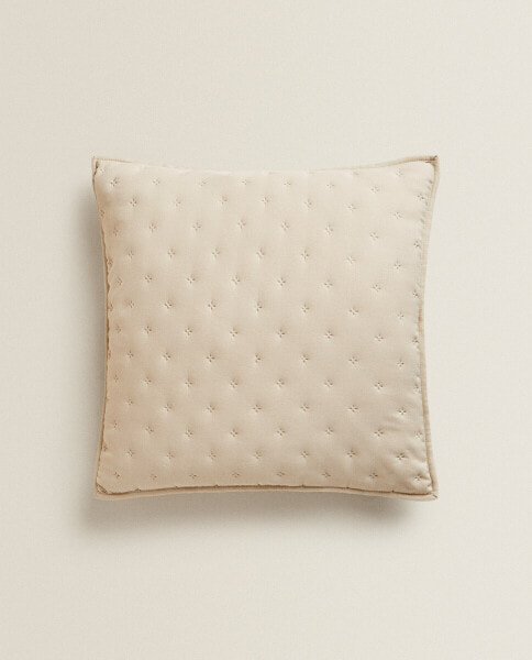 Quilted dotted cushion cover