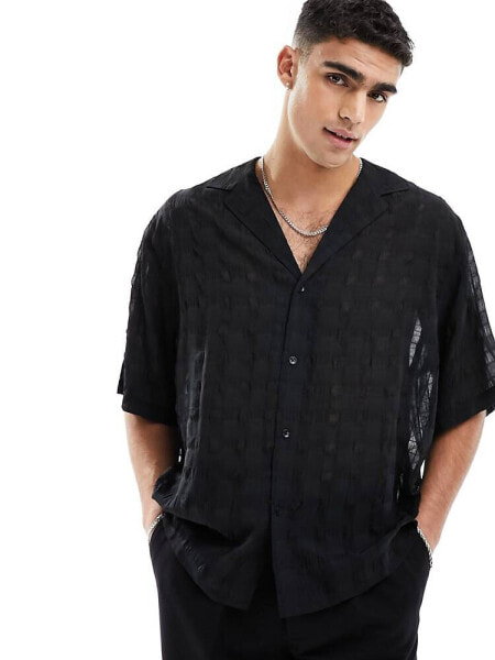 ASOS DESIGN boxy oversized half sleeve low revere shirt in seer sucker cotton in black