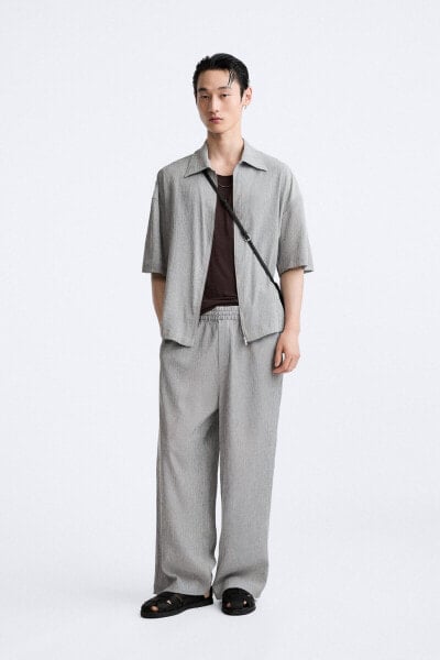 PLEATED TROUSERS