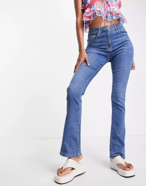 Parisian kick flare jeans in mid blue