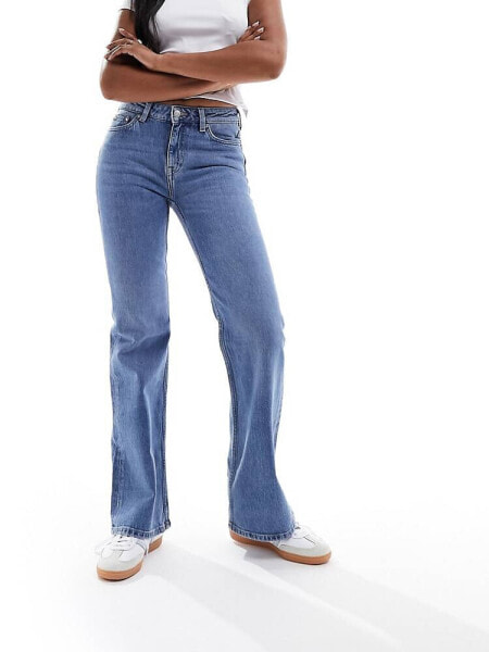 & Other Stories low rise flared jeans in mid blue wash