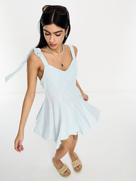 ASOS DESIGN linen tie cross strap swing mini sundress with godets in blue