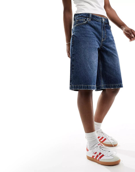 Bershka baggy longline denim shorts in washed indigo