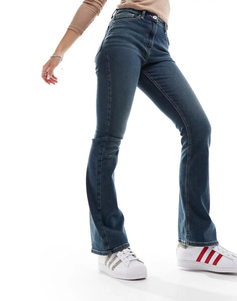 COLLUSION x007 stretch flare jeans in midwash blue