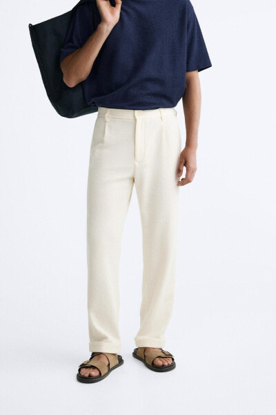 TEXTURED PLEATED TROUSERS