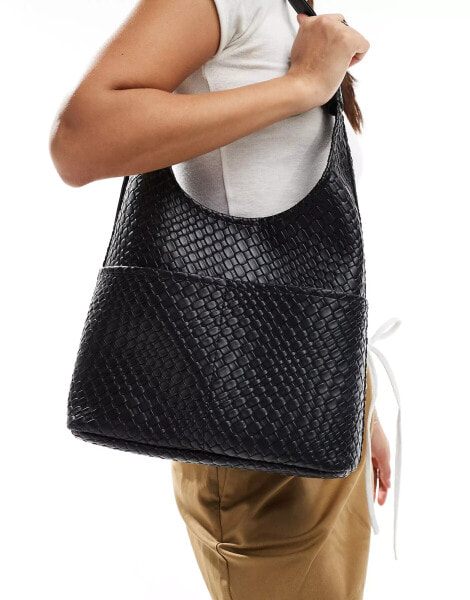 Glamorous large woven shoulder bag with pocket detail in black