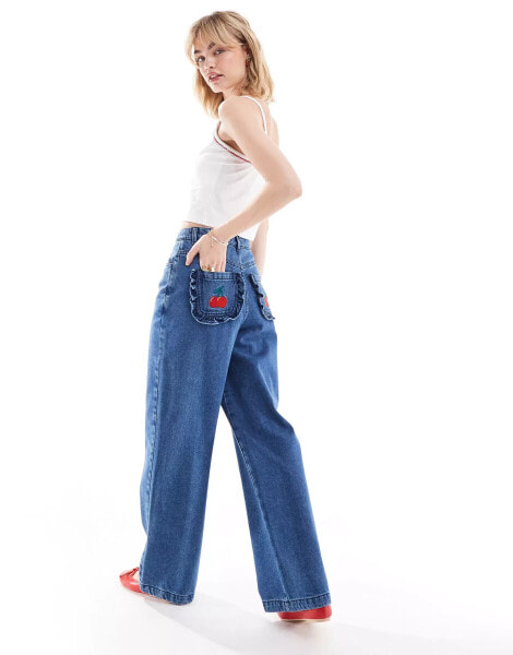 Neon Rose wide leg jeans with cherry applique pockets in mid blue