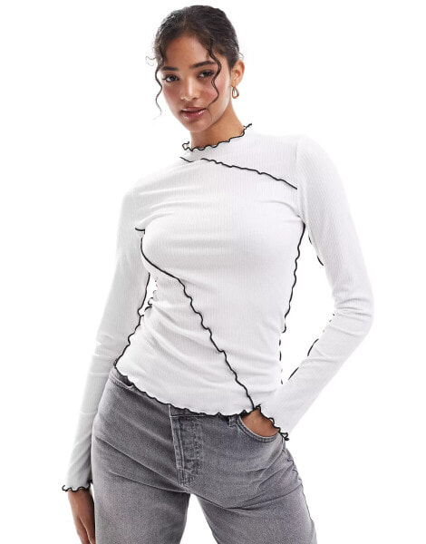 Pieces long sleeved top with contrast lettuce edge detailing in white