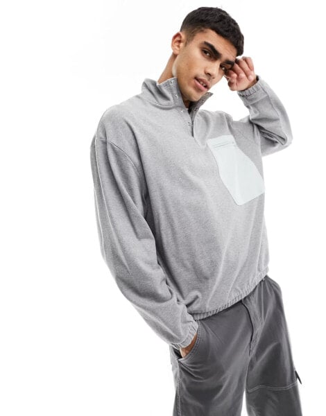 ASOS DESIGN oversized funnel neck sweatshirt with pocket detail in grey marl