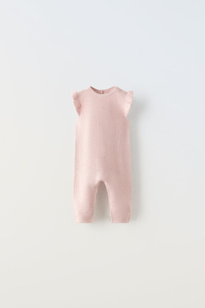Knit dungarees with ruffle trim