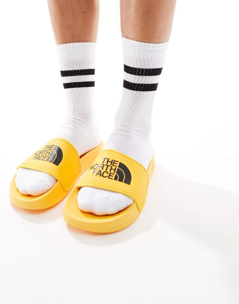 The North Face Base Camp III slides in yellow and black