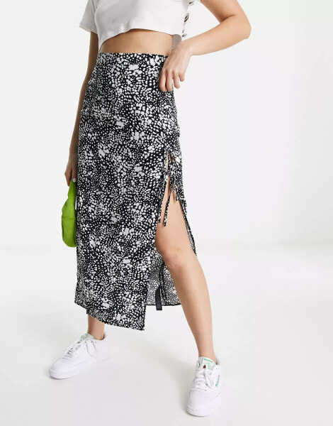 ASOS DESIGN bow detail midi skirt with thigh split in mono smudge print