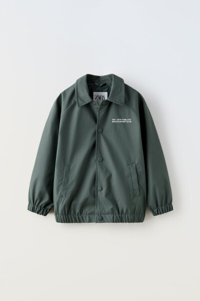 Rubberised jacket with slogan