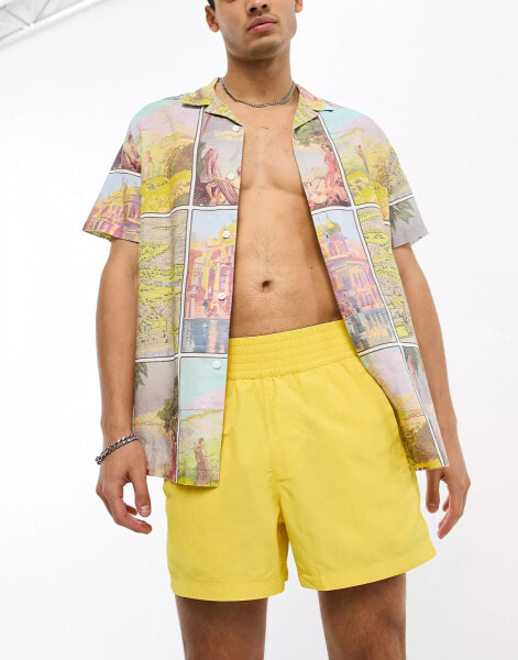 ASOS DESIGN swim shorts in short length with thick waistband in yellow