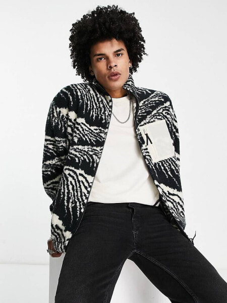 ASOS DESIGN oversized zip through jacket in black borg with all over print