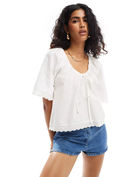 ASOS DESIGN gathered tie front lace trim blouse in white