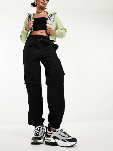 Noisy May cargo trousers with pocket details in black