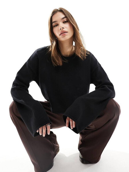 Monki cropped long sleeve knitted top in black