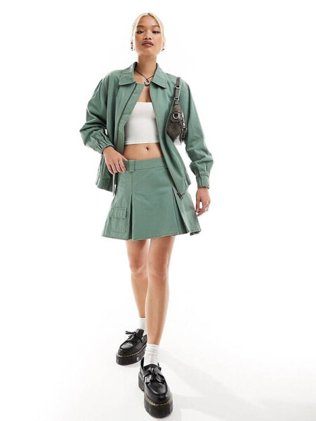 Something New X Chloe Frater denim box pleat cargo mini skirt co-ord in washed watercress green 