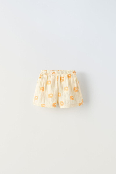 Contrast crepe bermuda shorts with palm tree print