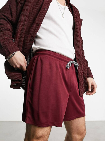 ASOS DESIGN oversized shorts in burgundy sporty mesh