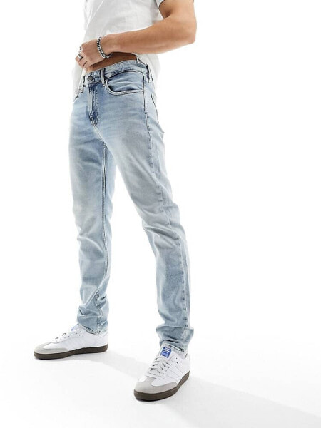 Calvin Klein Jeans slim tapered jeans in light wash