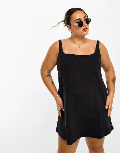 ASOS DESIGN Curve denim pinny dress in black