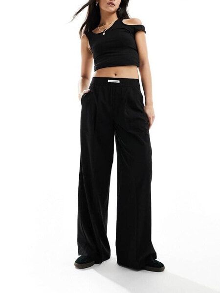 Bershka deep waistband wide leg trousers in black