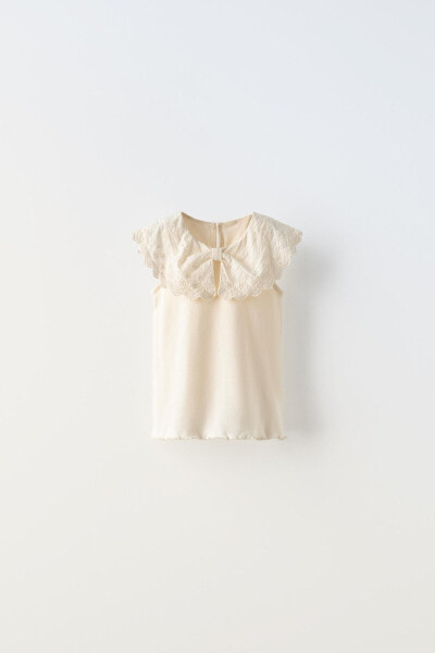 Embroidered bow neck top