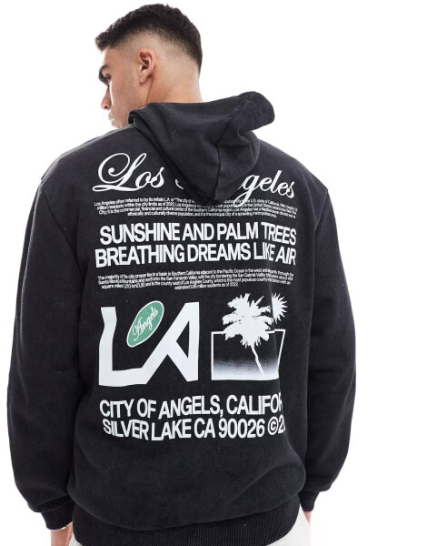 ASOS DESIGN oversized hoodie with Los Angeles text print in washed black