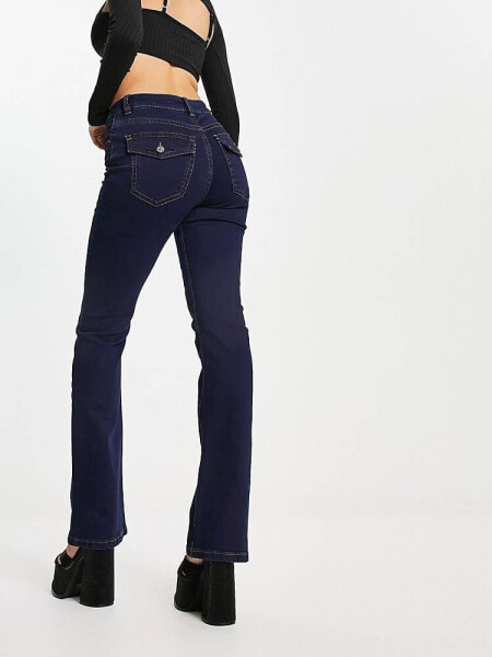 ASOS DESIGN low rise flared jeans with western pocket detail in dark blue