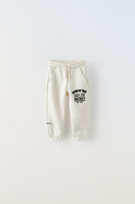 Jogger trousers with flocked slogan