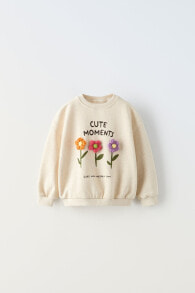 Sweatshirt with floral appliqués