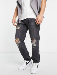 Men's Jeans jack &amp; Jones – Chris – Locker geschnittene Jeans in Schwarz mit Rissen an den Knien